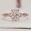 7 stone diamond ring with oval shaped center.
