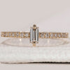 Baguette diamond wedding band with prong setting band.
