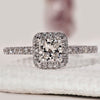 Princess cut engagement ring with pave diamond ring.
