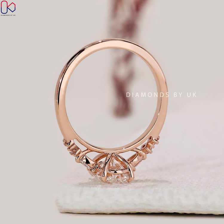 Buy engagement ring with cathedral setting and claw prongs.
