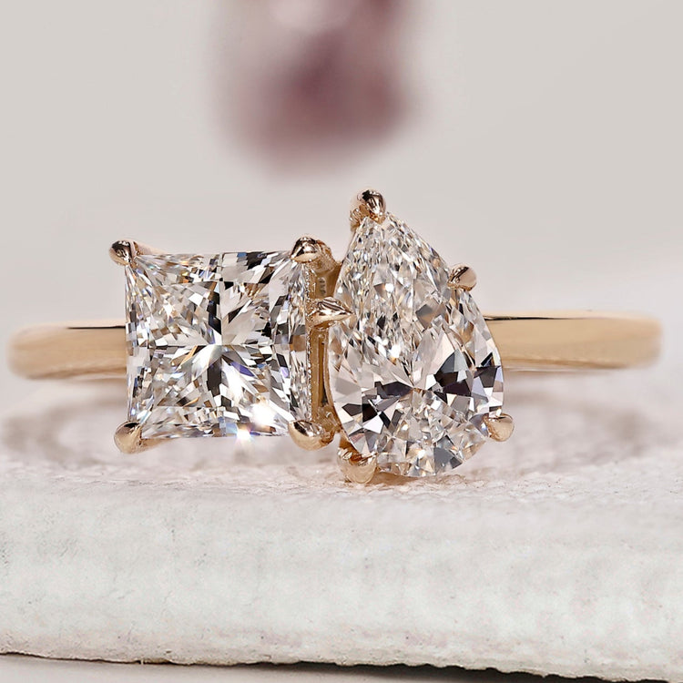 2 stone engagement ring featuring two contrasting diamond shapes.
