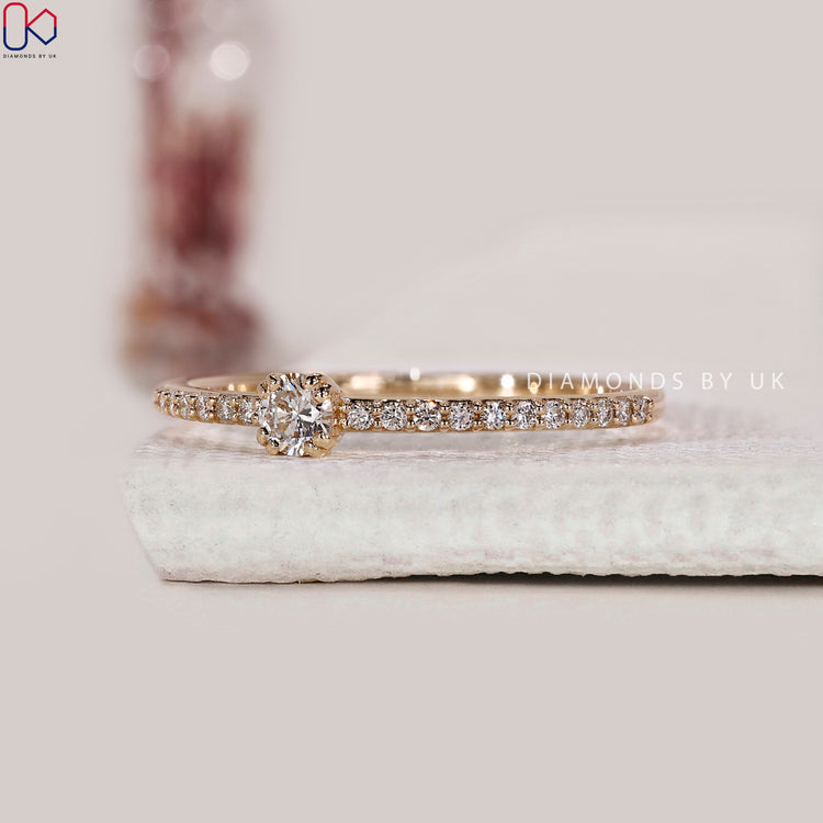 Handmade yellow gold engagement ring with round diamond.
