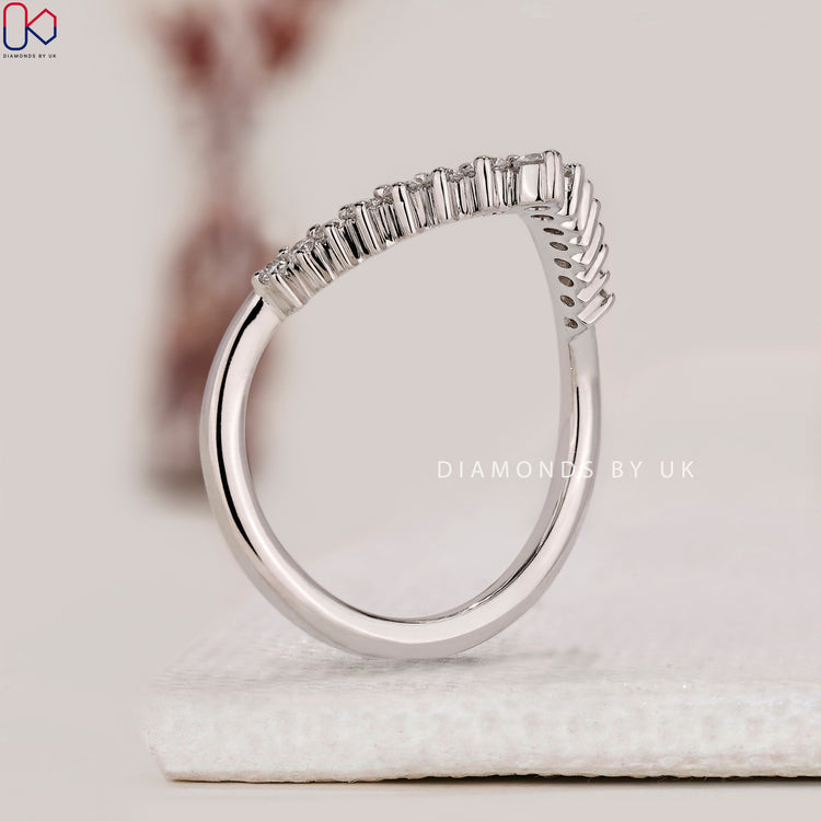 Handmade jewellery featuring a white gold V shaped band.
