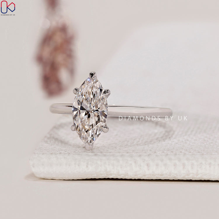 Simple engagement ring with a solitaire diamond.
