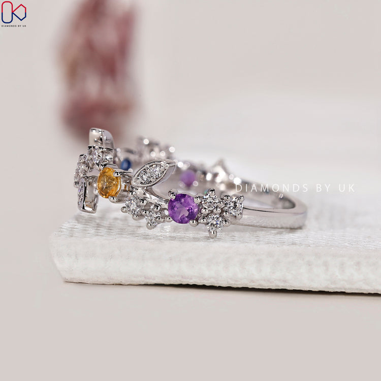 Custom wedding band featuring lab grown alexandrite and topaz.
