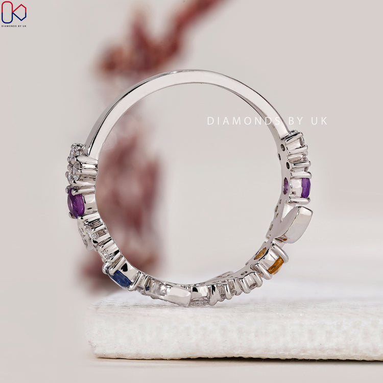 Topaz diamond wedding band with half eternity design.
