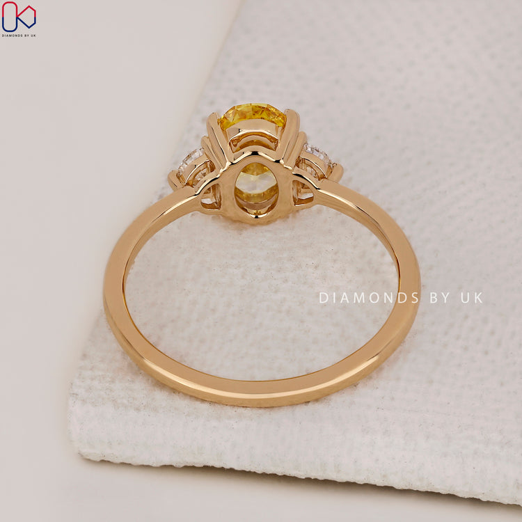 Oval Diamond Ring with Half Moon Side Stones for a unique touch.
