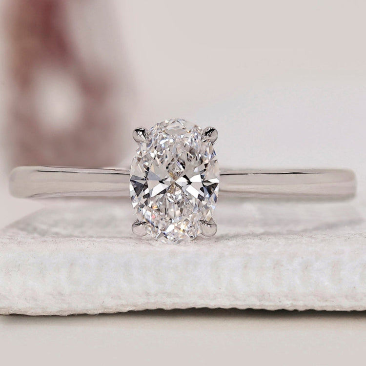 Oval Cut Diamond Ring featuring a 4 prong claw setting, set in a white gold.
