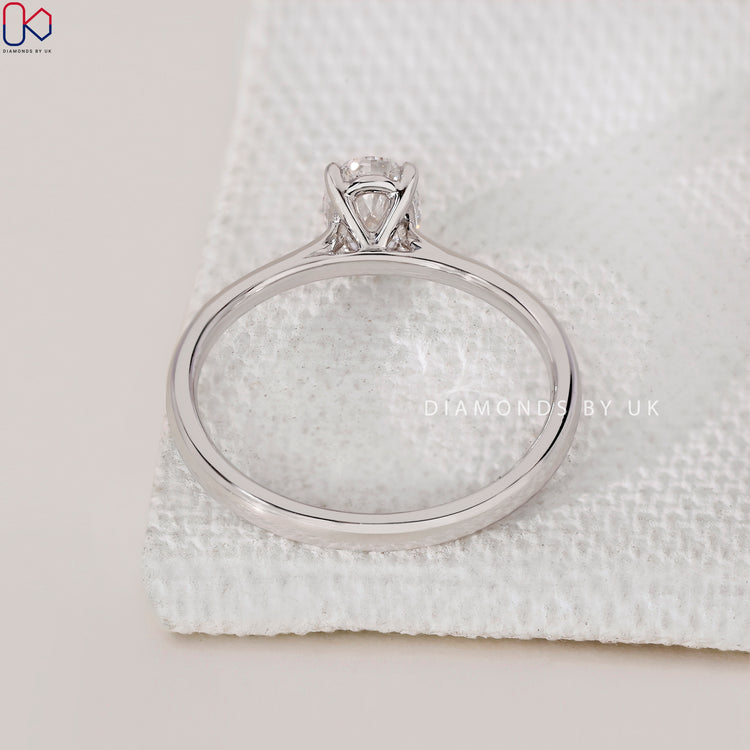 Lab Grown Diamond Oval Cut Engagement Ring, set in a white gold band with a cathedral setting for a unique design.
