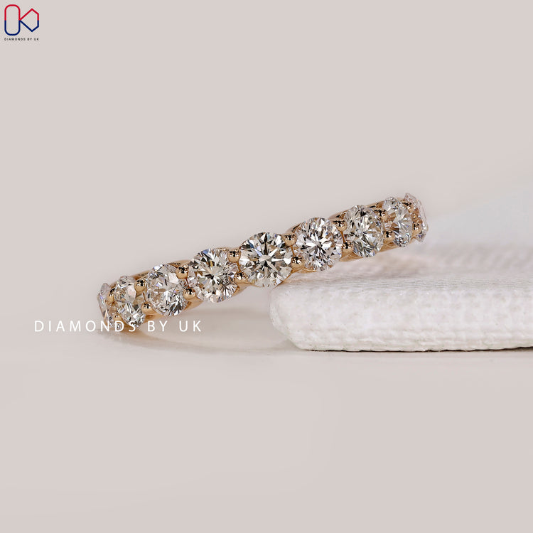 Shared prong wedding band by Diamondsbyuk.
