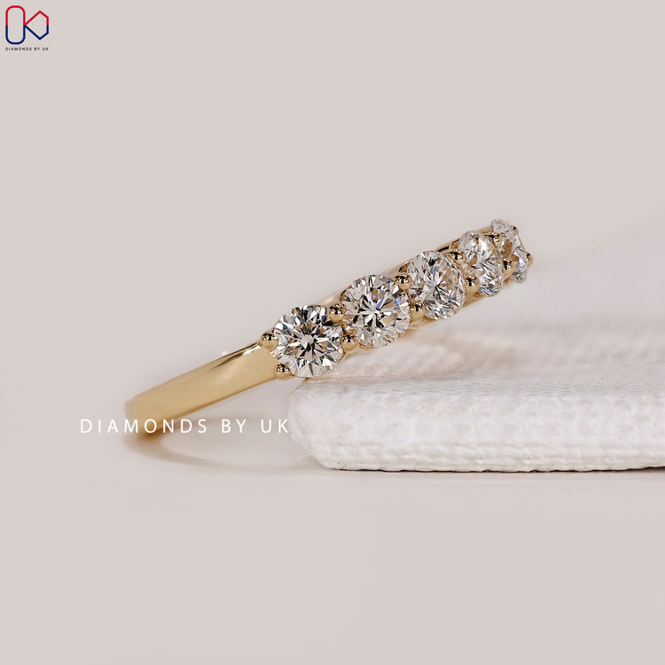 Custom diamond band in yellow gold.
