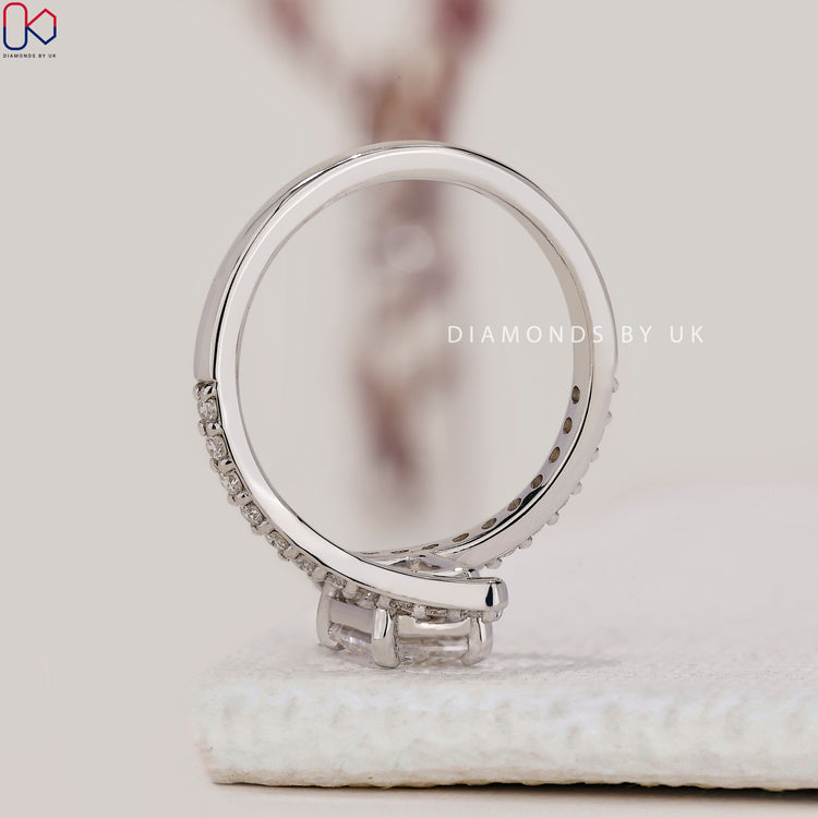 White gold diamond ring with bypass design.
