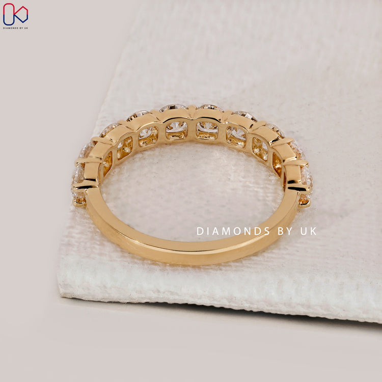 Handmade jewellery shared prong wedding band.
