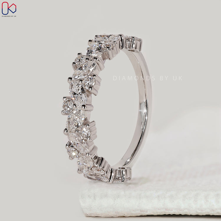 Custom diamond band with marquise and round stones.
