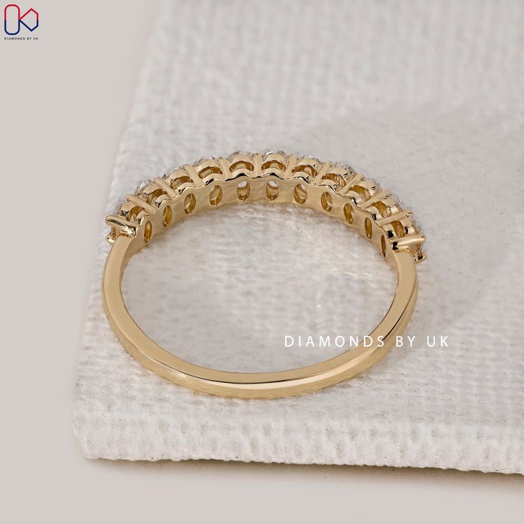 Diamondsbyuk yellow gold half eternity wedding band.

