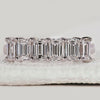 Emerald cut wedding band in white gold.
