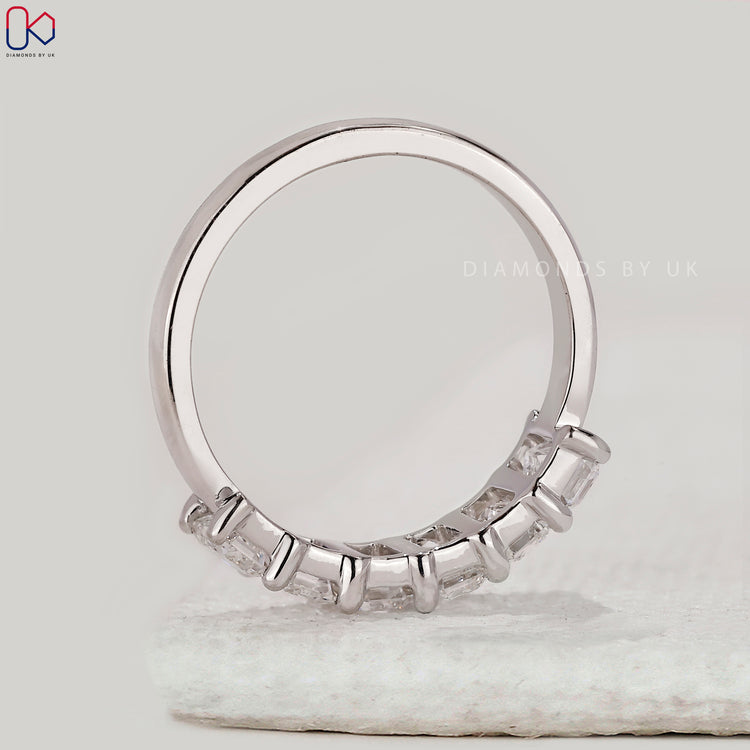 Handmade band with emerald cut diamonds.
