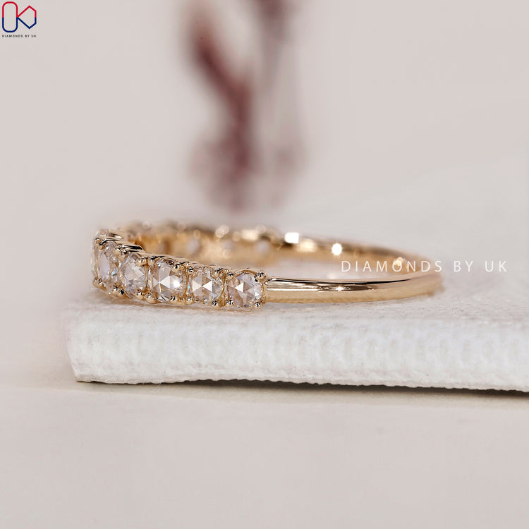 Minimalist wedding band with rose cut diamonds for simplicity and elegance.

