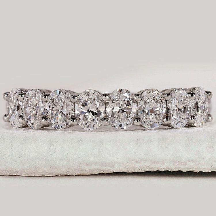 Oval diamond wedding band in white gold.
