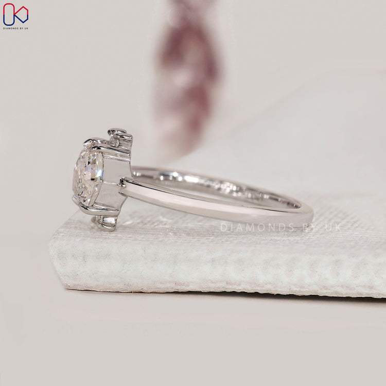Baguette side stone east west diamond ring.
