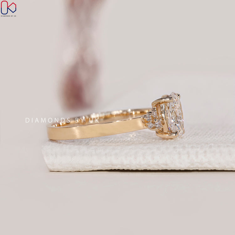 Oval lab grown diamond engagement ring in yellow gold.
