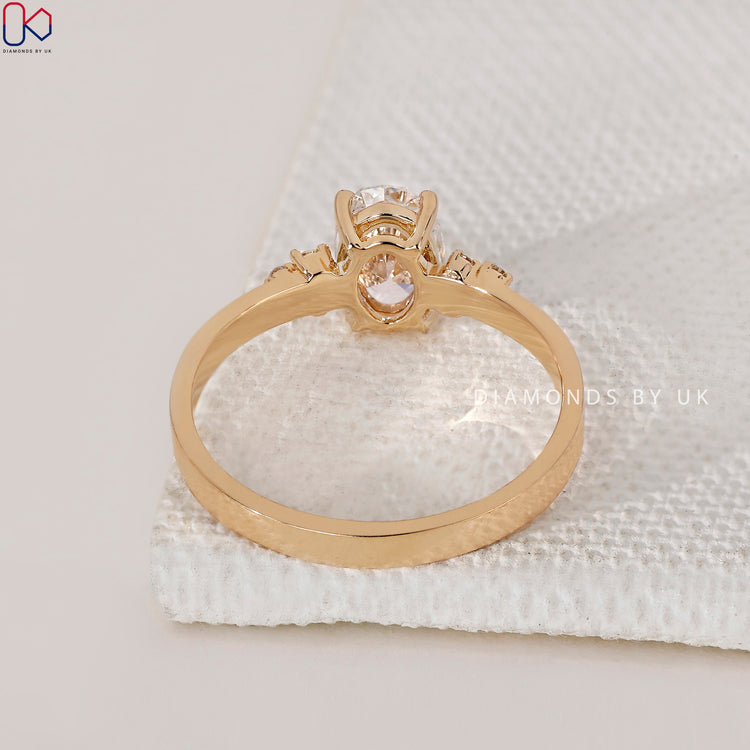 Diamondsbyuk engagement ring featuring a round diamond.
