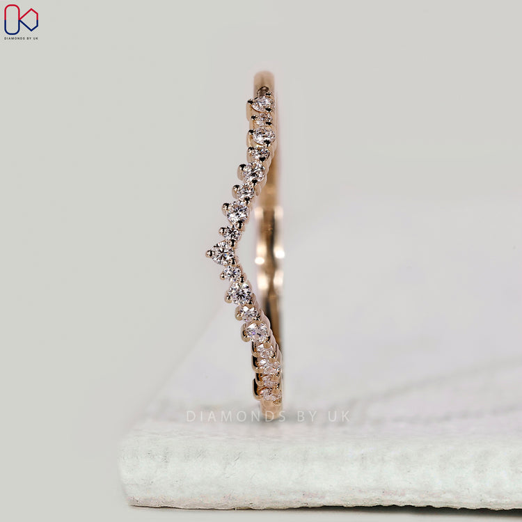 Shared prong wedding band with round diamonds.
