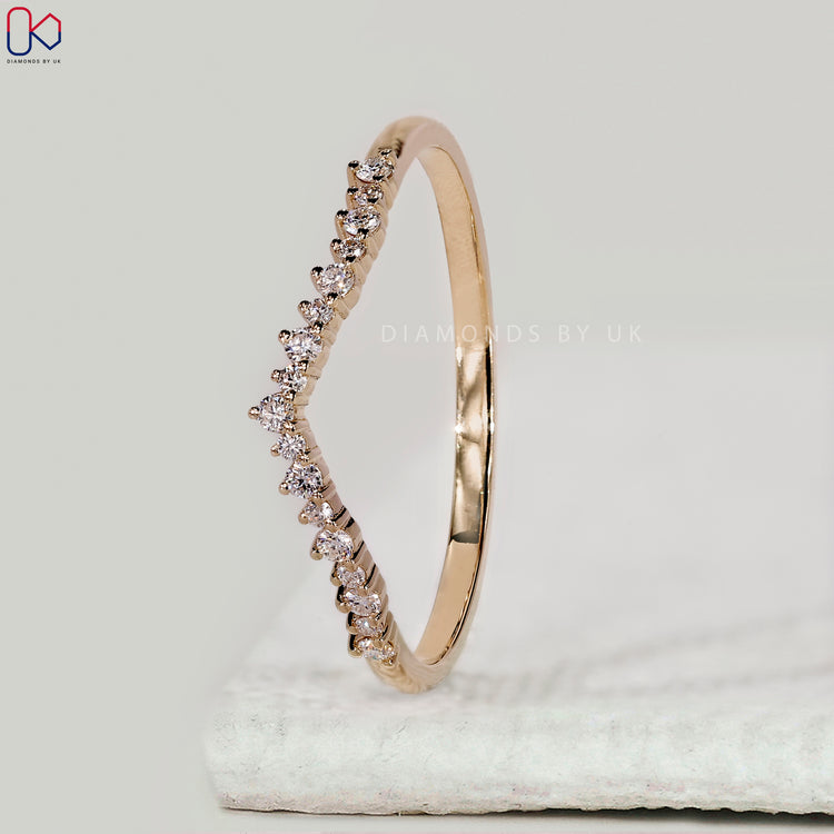 Half eternity wedding band with round diamonds.
