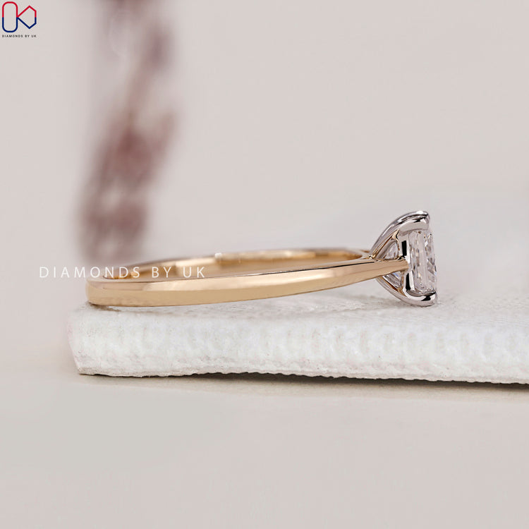 Customised engagement ring with a princess cut diamond.
