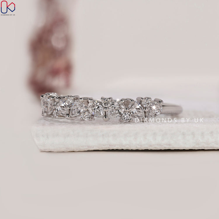 Half eternity band with pear shaped diamonds.
