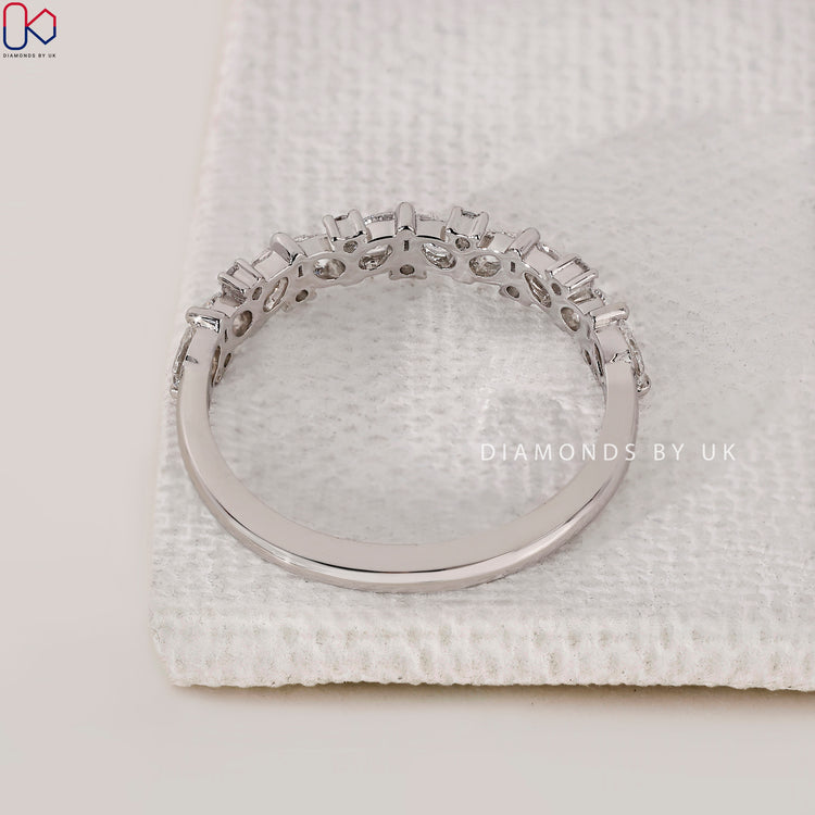 Handmade jewellery wedding band with pear shaped diamonds.
