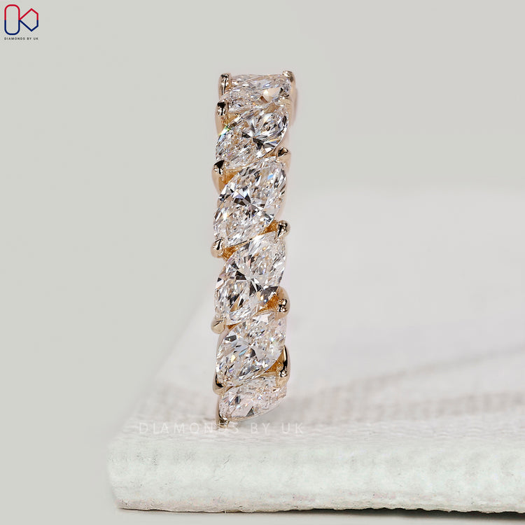 Yellow gold wedding band with marquise diamonds.
