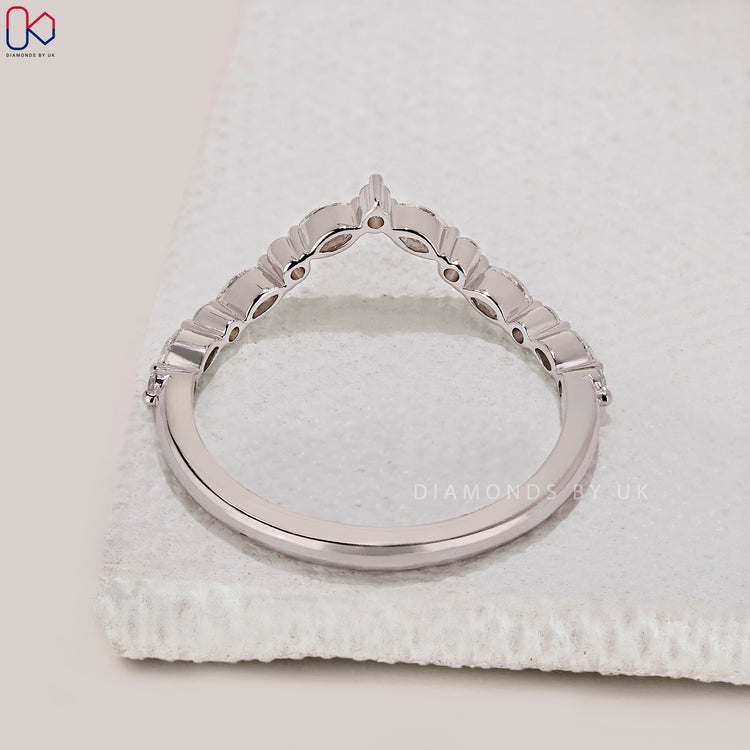 Handmade band with marquise and round diamonds.
