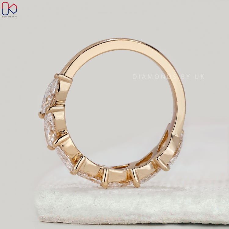 Handmade band with marquise diamonds.
