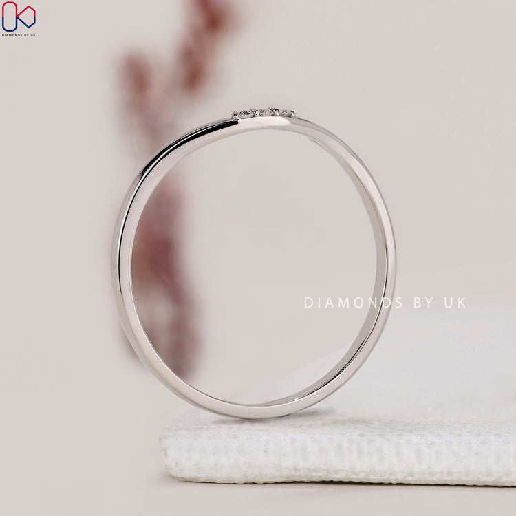 3 stone band symbolising past, present, and future.

