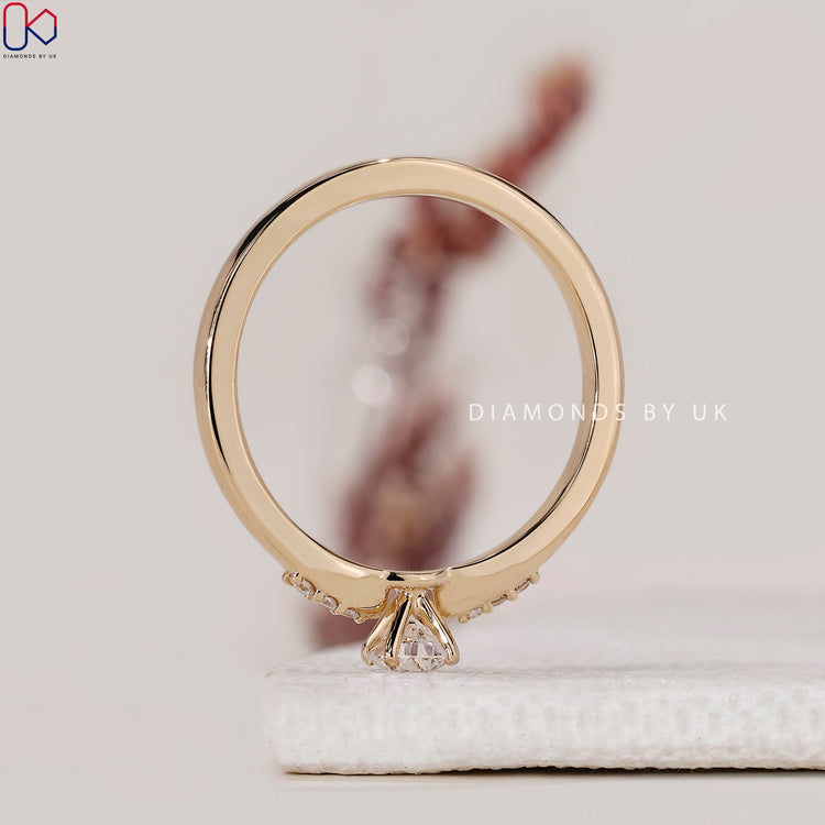 Lab diamond ring with round cut and side stones
