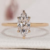 Marquise cut diamond ring set in a gold band.
