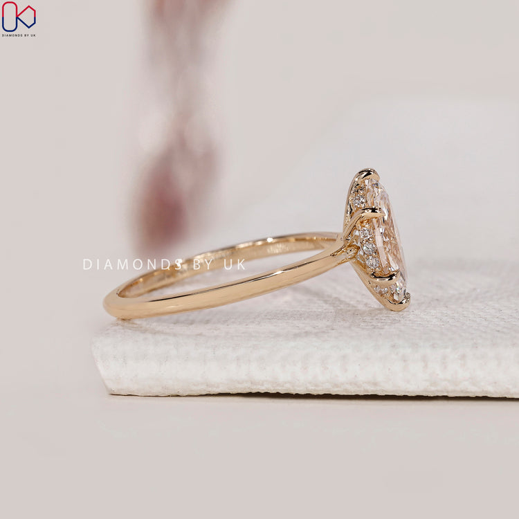 Marquise diamond ring with a hidden halo for extra brilliance.
