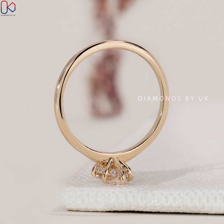 IGI certified marquise ring with a yellow gold setting.
