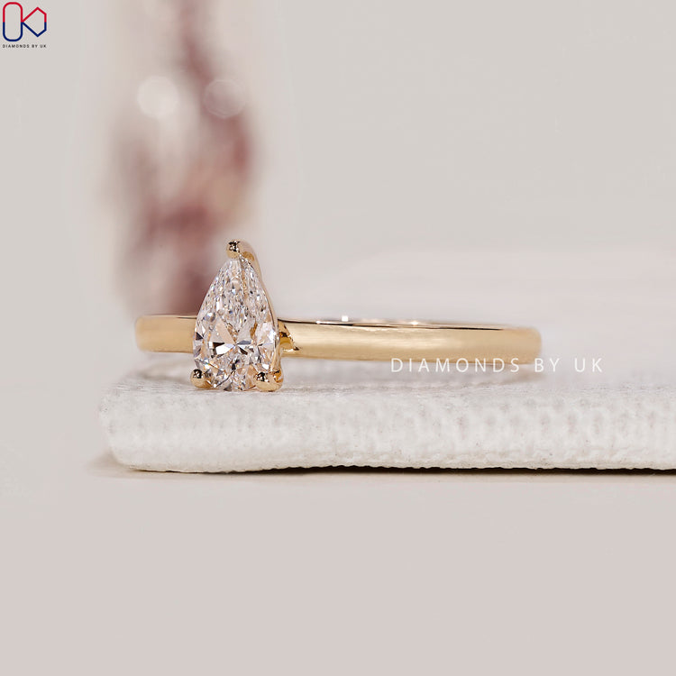 Yellow gold pear cut engagement ring
