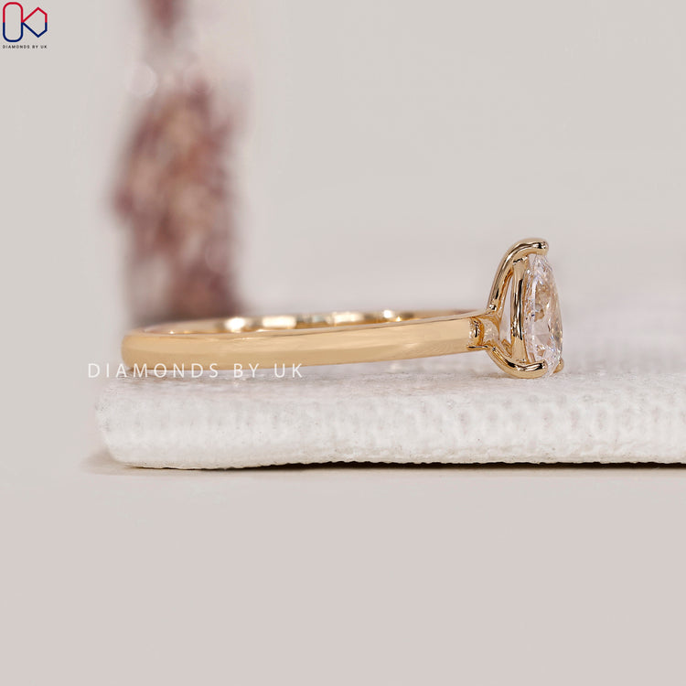 3 round prong pear diamond ring
