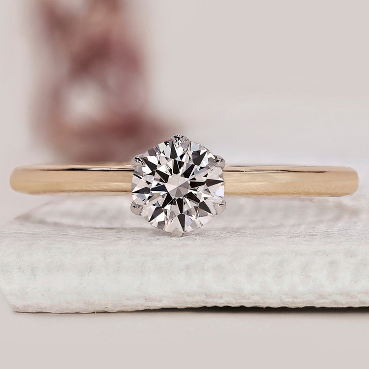 Solitaire diamond engagement ring in two-tone gold
