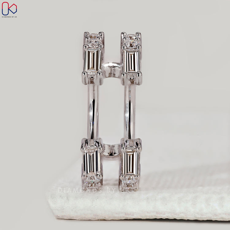 Wrap guard wedding band with baguette and round diamonds.
