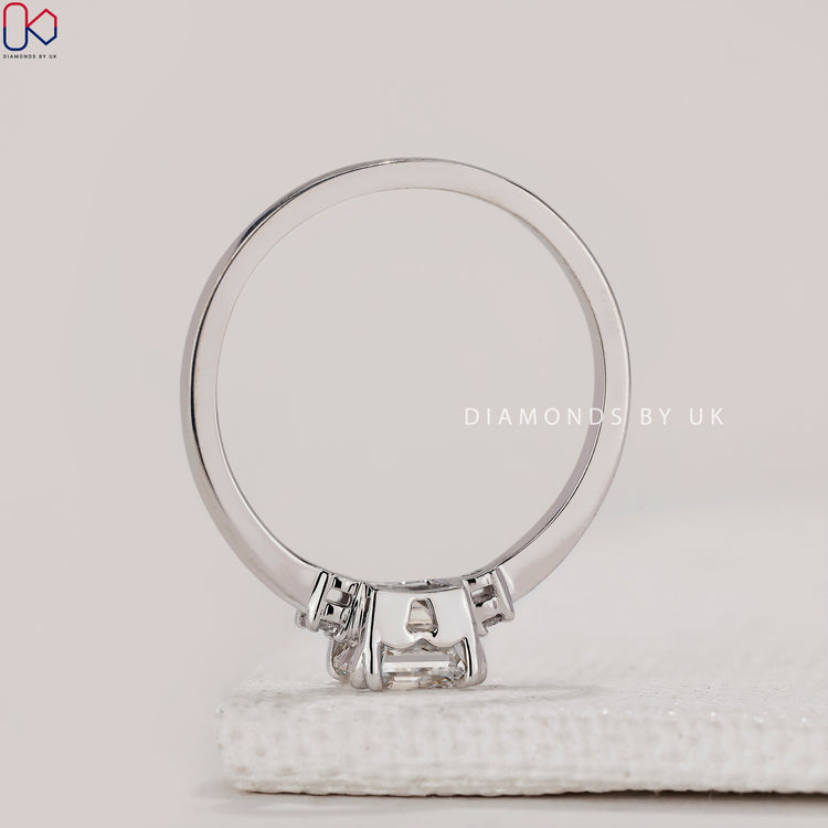 Elegant three stone engagement ring with prong setting.
