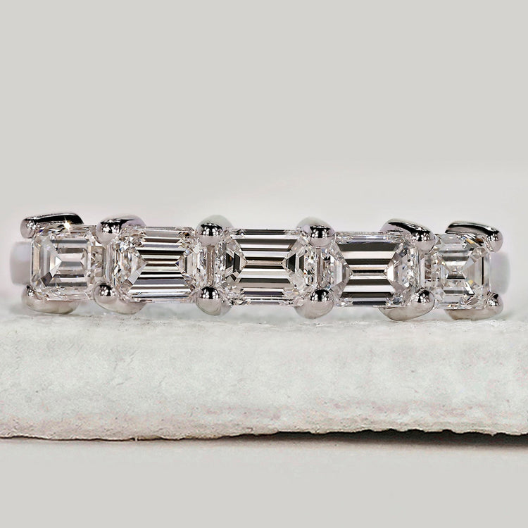 Round diamond wedding band in yellow gold.
