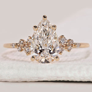Pear Shaped Engagement Ring with Round Side Stone
