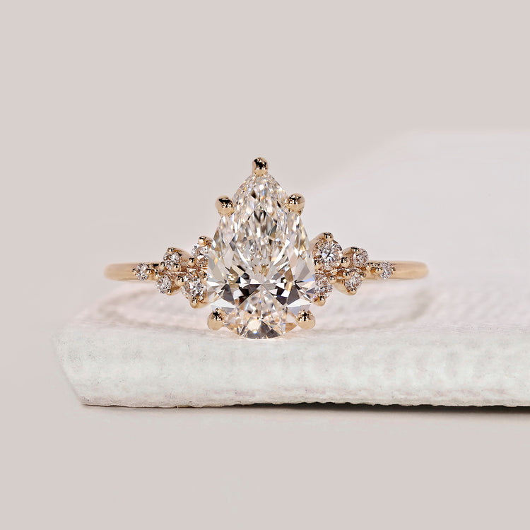 Pear Shaped Engagement Ring with Round Side Stone
