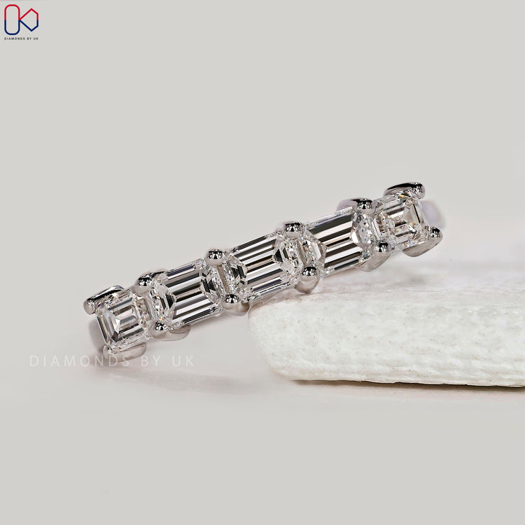 Yellow gold wedding band with round diamonds.
