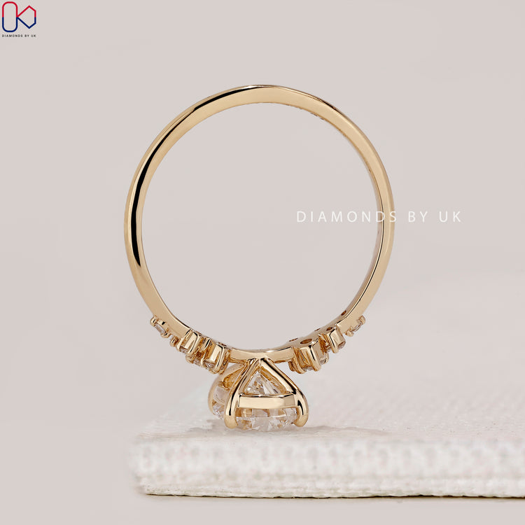 Handmade yellow gold muse setting engagement ring.
