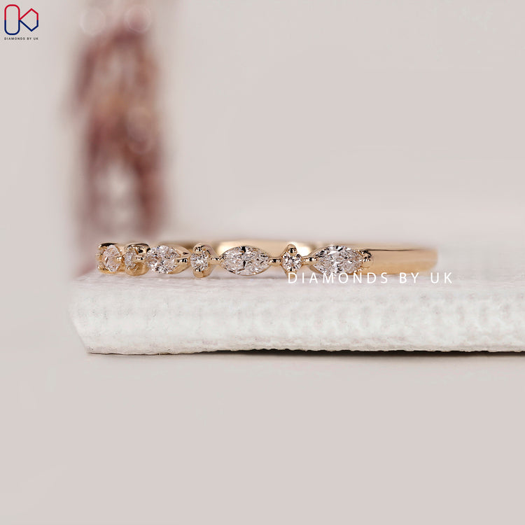 Elegant half eternity band with marquise diamonds
